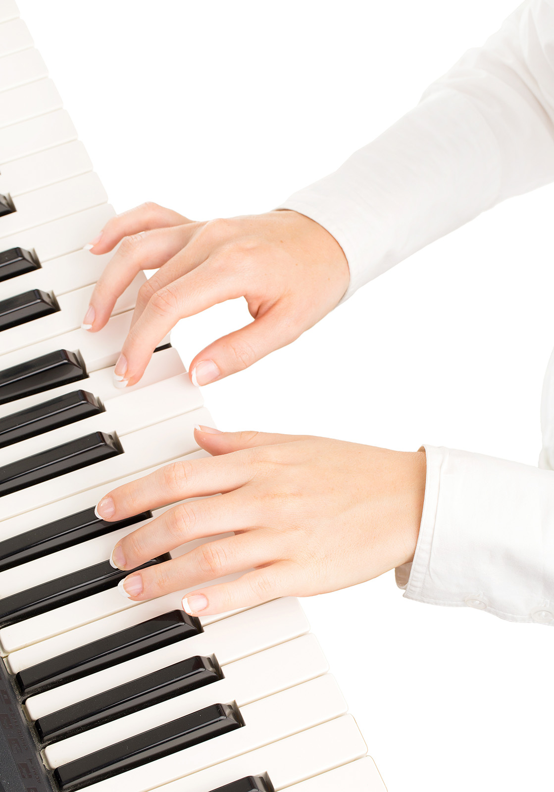 young hands of woman playing synthesizer isolated on white